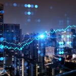 aerial night panoramic cityscape and FOREX graph hologram as the concept of market analysis