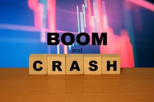 Boom and CRASH message word on a wooden desk